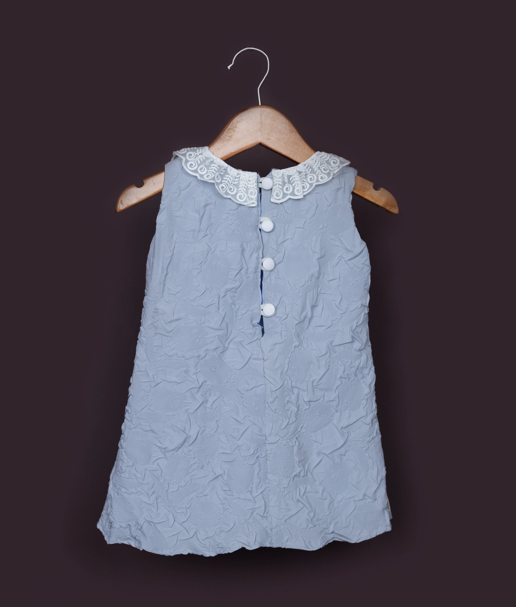 Light blue baby girl birthday frock with back buttons and delicate lace