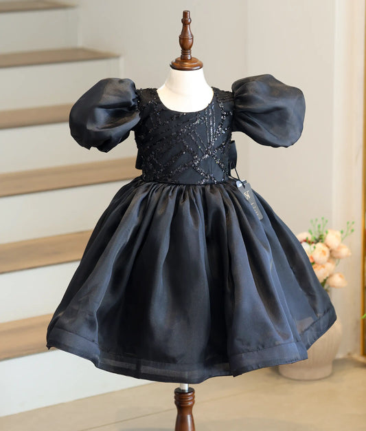 Front view of black organza birthday frock for baby girls featuring a sequin-embellished fancy top