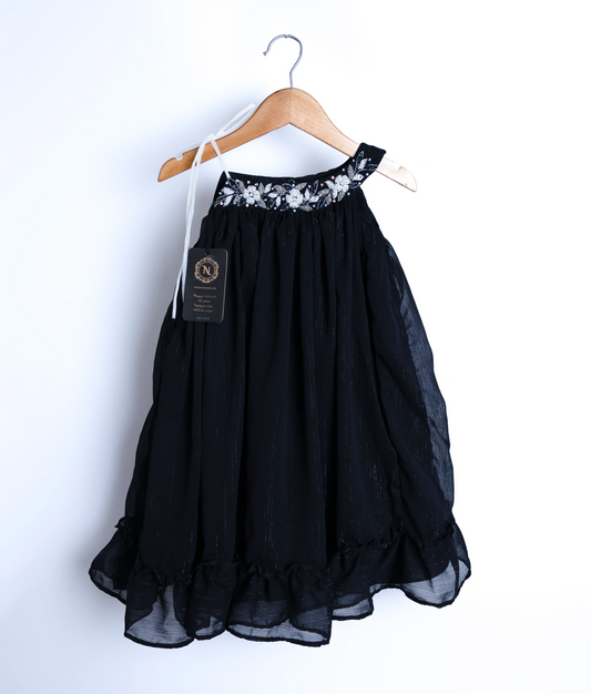 Front view of a black shimmer georgette frock for baby girls with white floral handwork and pearls