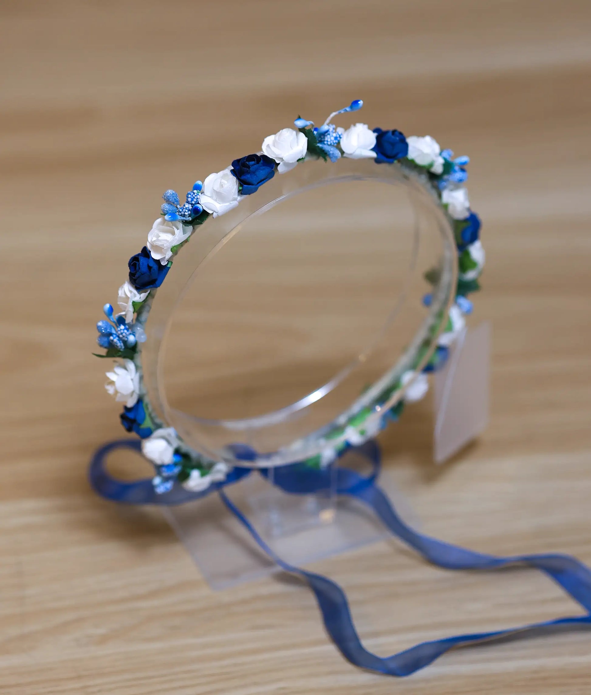 Close-up of premium blue and white floral accents on a handcrafted boutique baptism hair accessory for baby girls