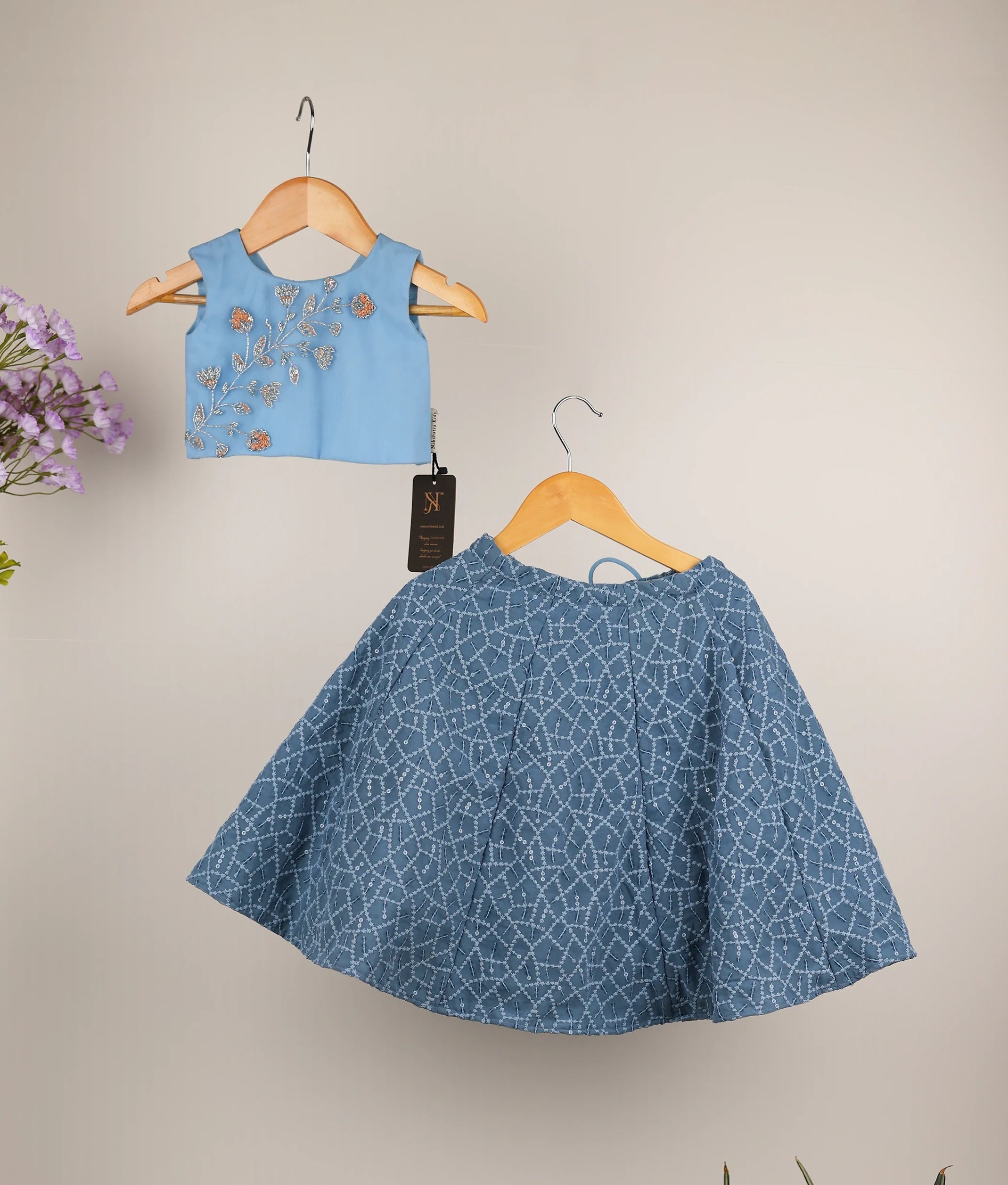 Front view of a girls' blue handworked tulle top and ash georgette panel-cut full-length skirt set