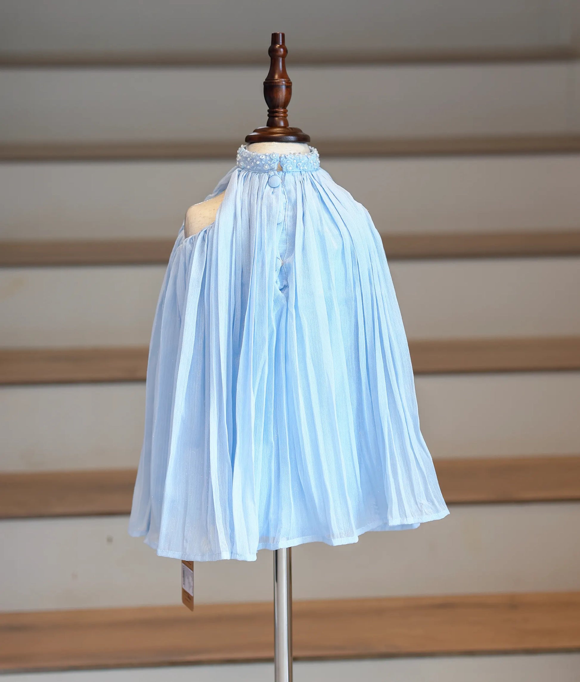 Back view of the blue shimmer georgette frock showing the high-neck finish.