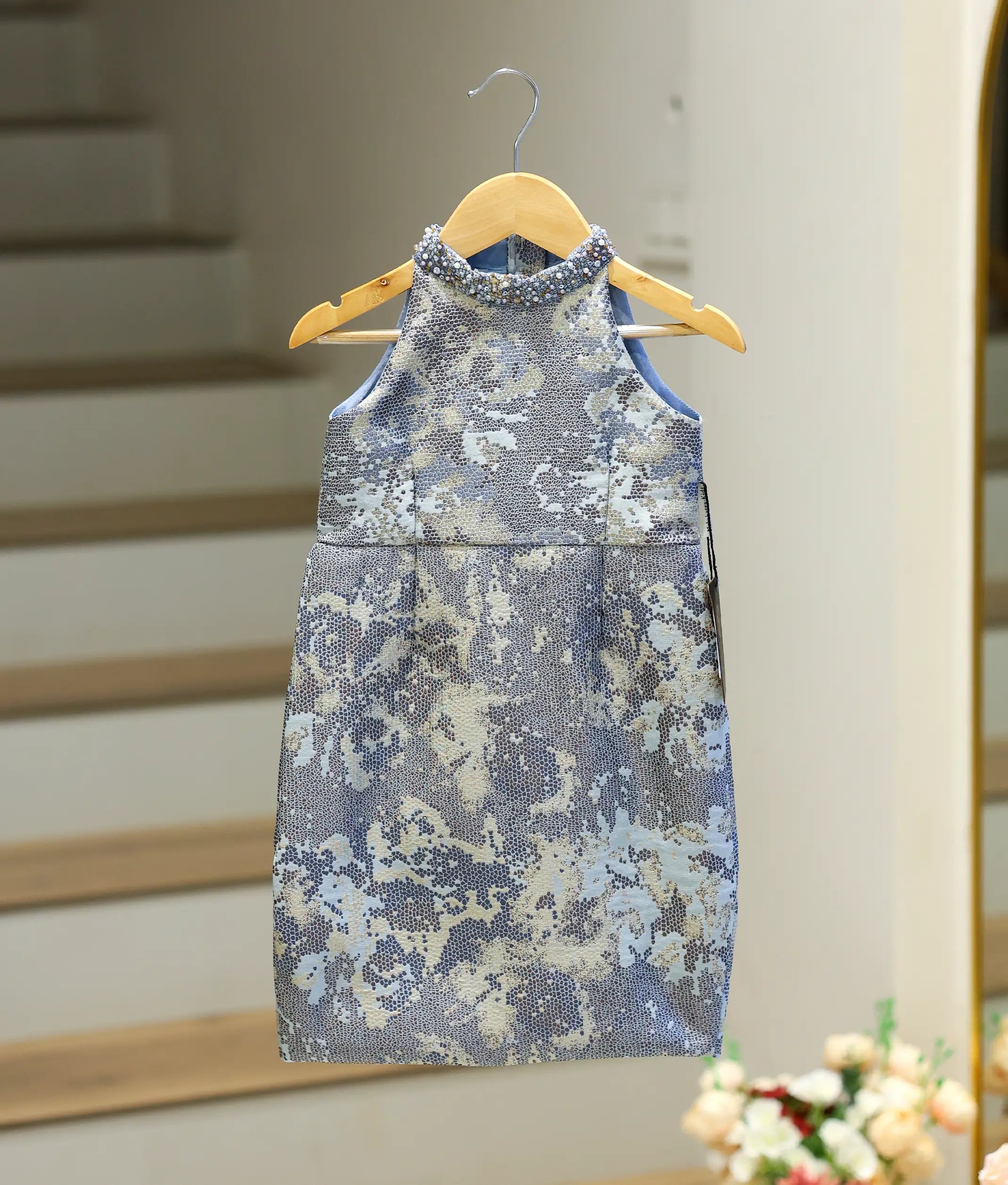 Front view of a blue jacquard organza fish-cut birthday frock for girls.