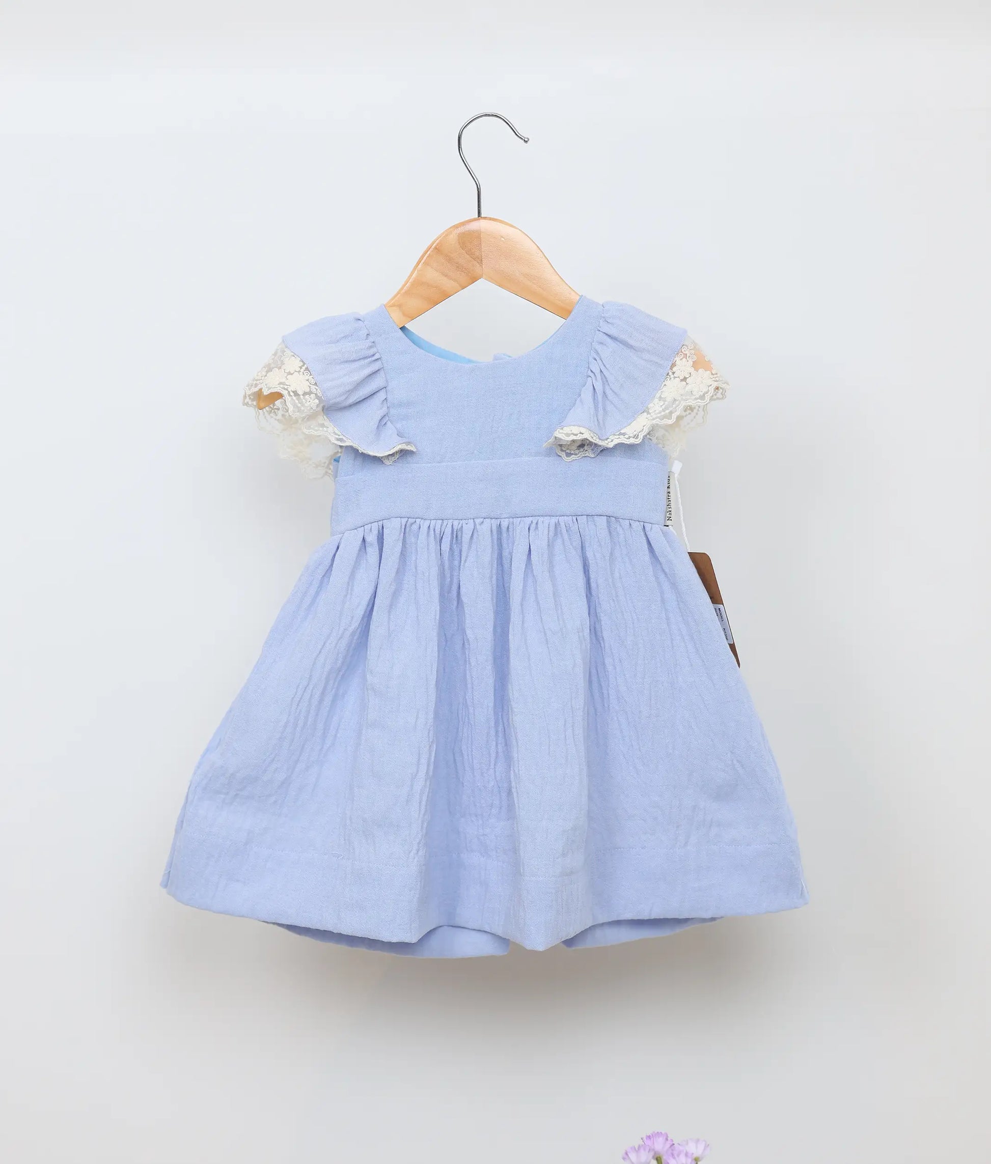 A blue linen christmas frock for baby girl.