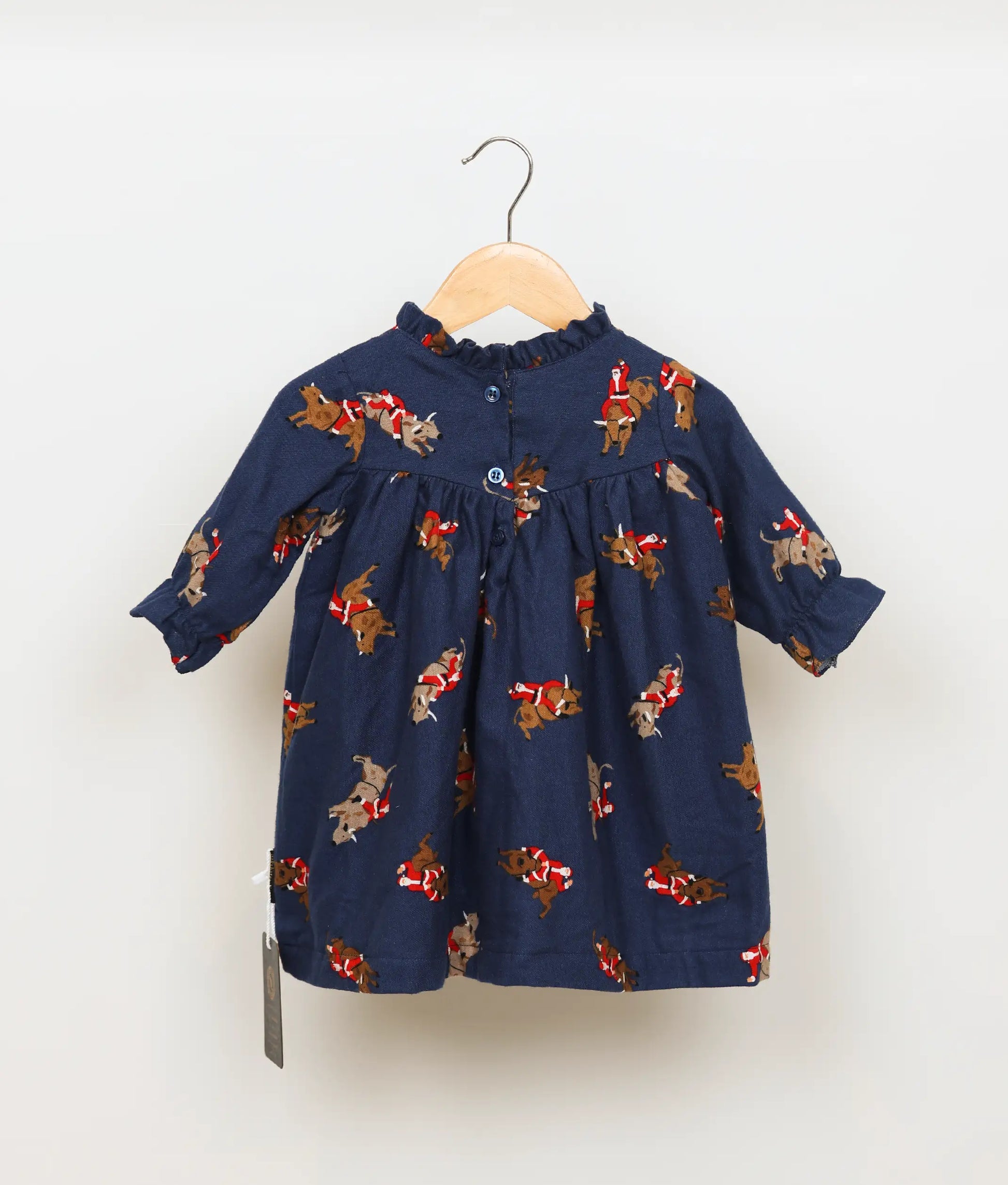 Back view of A-line blue cotton skirt and leg-o-mutton sleeved Christmas dress.