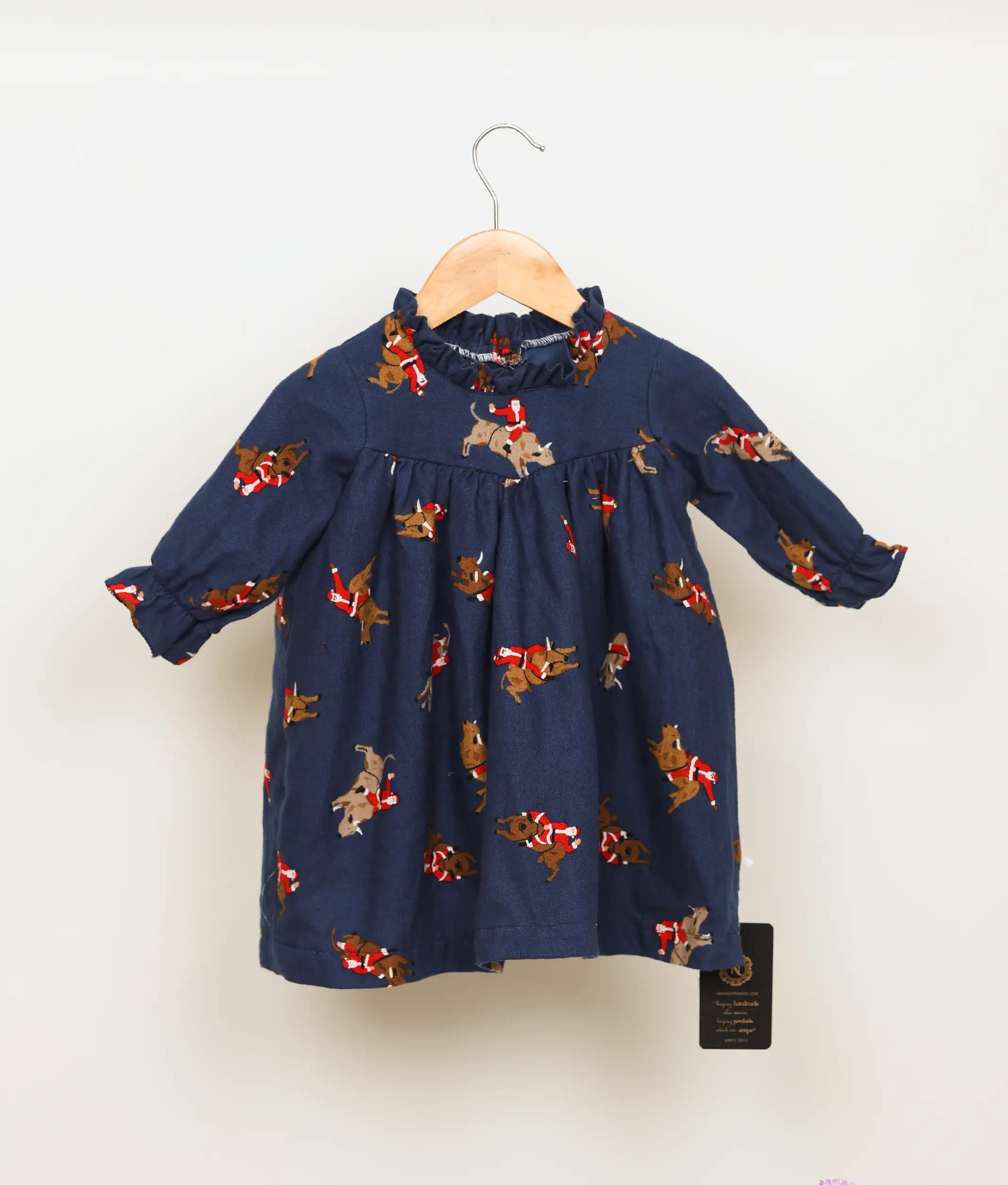 Blue Santa Claus printed yoke cotton Christmas dress with leg-o-mutton sleeves for baby girls.