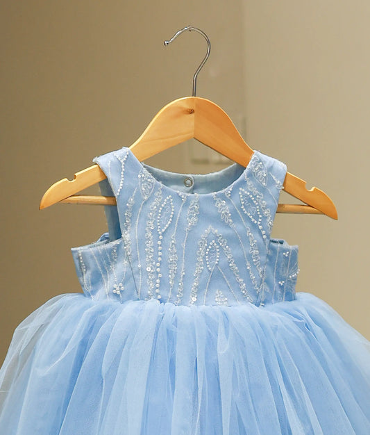 Close-up of the blue gown's yoke highlighting the intricate handwork with pearls, sequins, and beads.