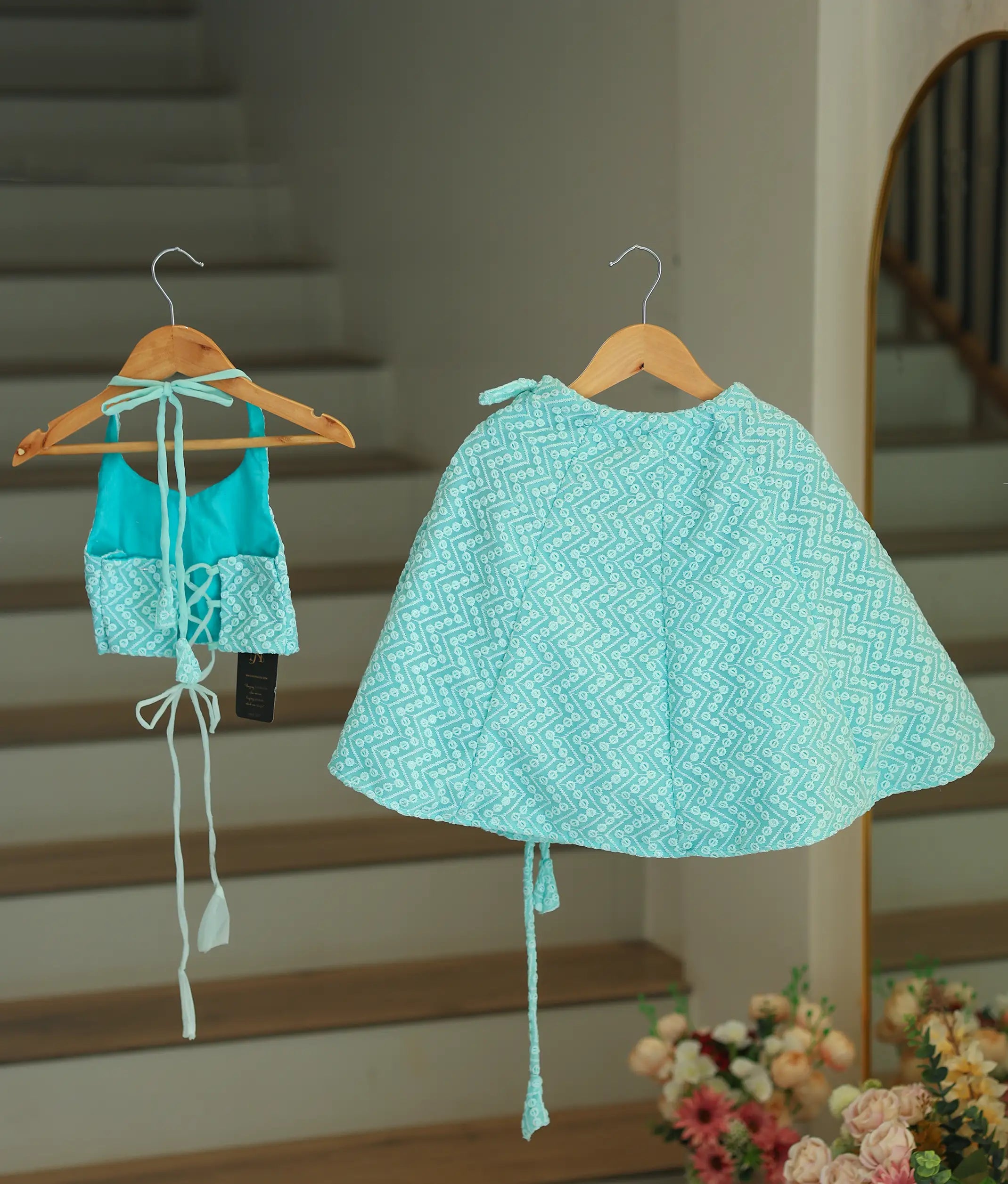 Back view of the blue georgette skirt and top showing the square neck design and adjustable back ties