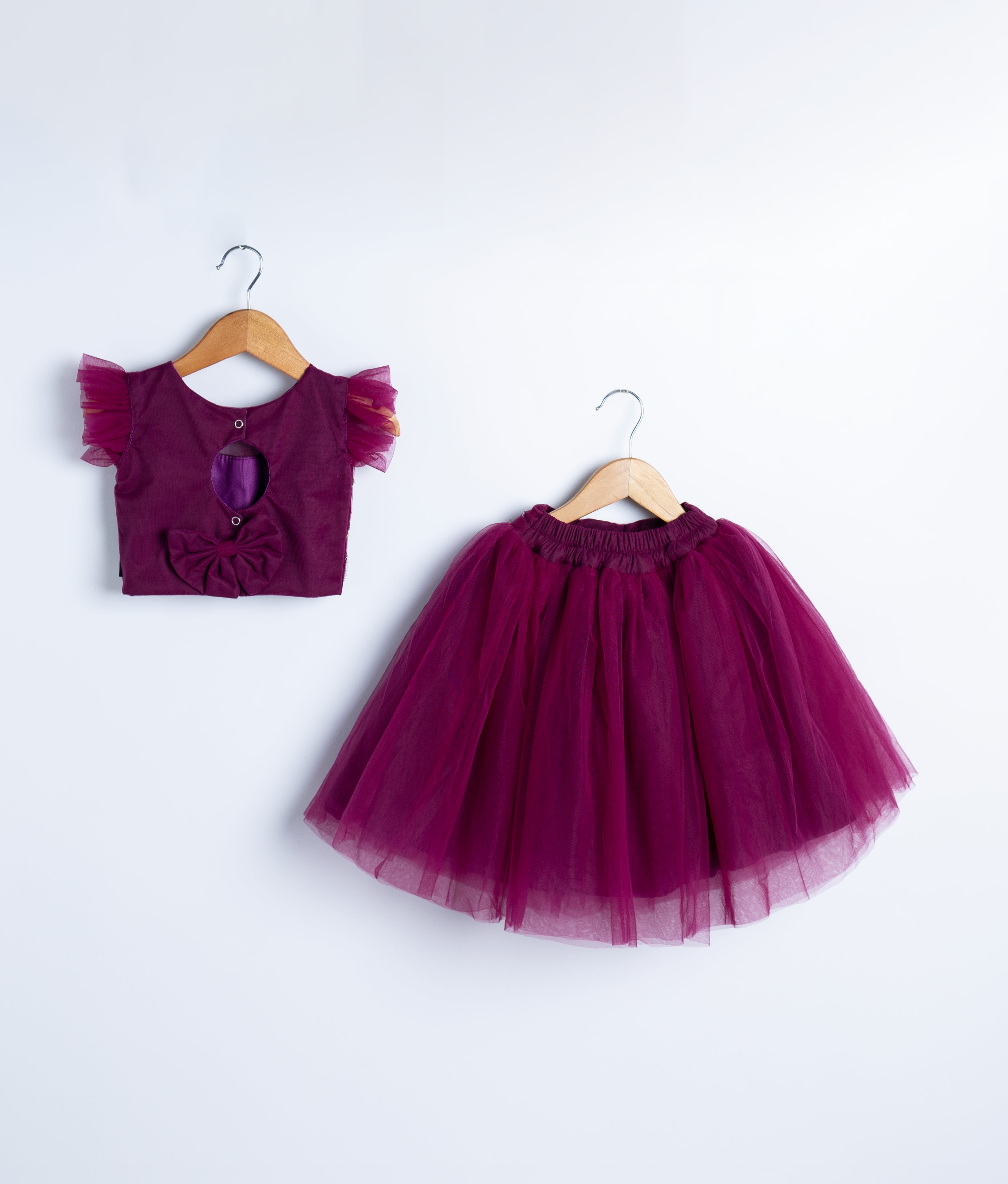 Two-piece burgundy formal dress with sequined top and matching tulle skirt for special occasions