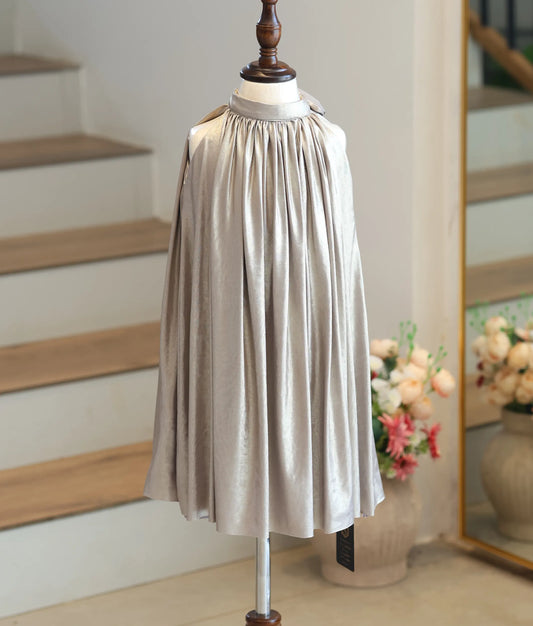 Front view of a girl's champagne gold shimmer lycra frock with a high neck and wide circular flare.