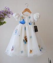 Front view of an off-white organza Disney princess themed birthday gown for baby girls with character art