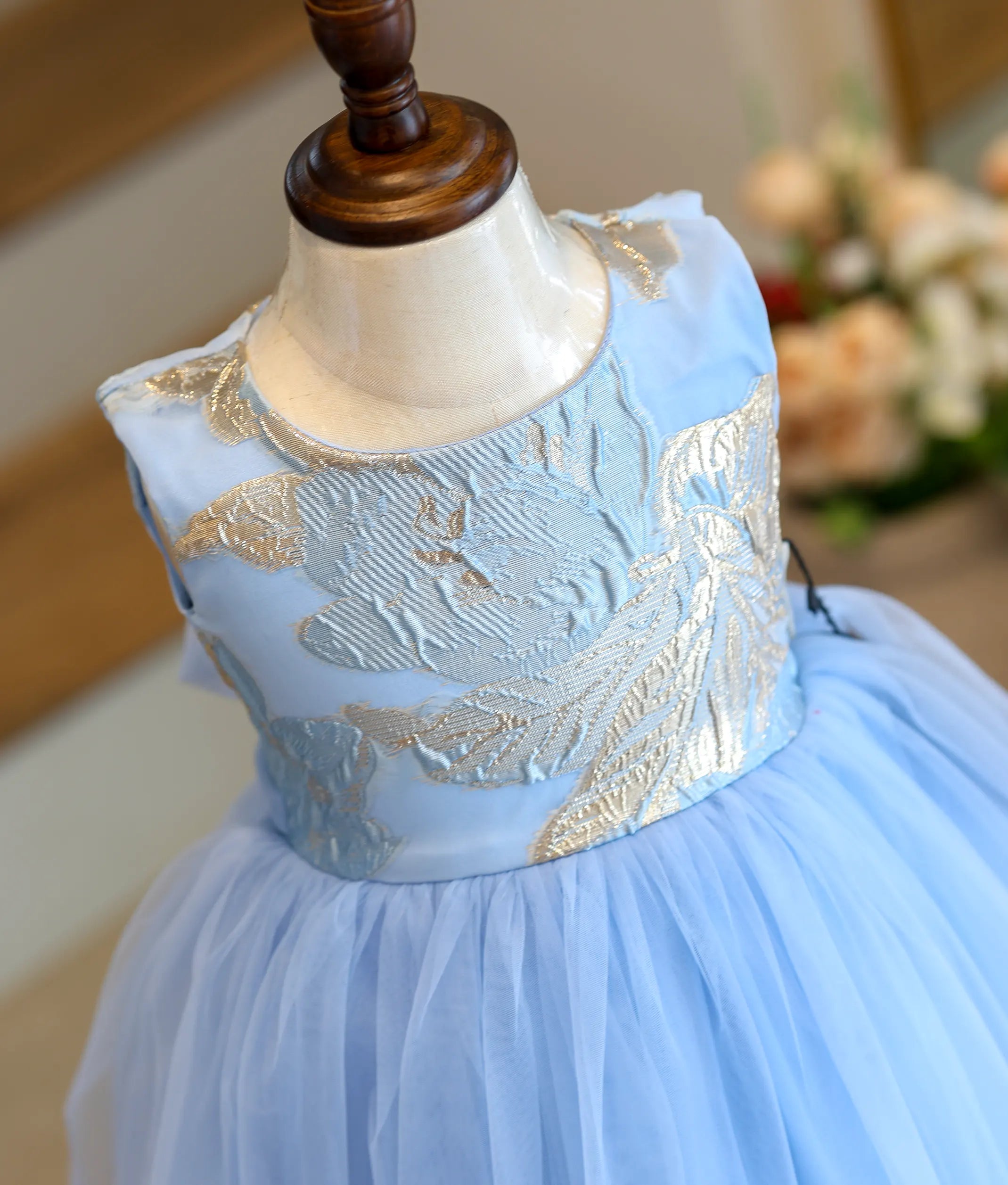 Close-up of the golden Turkish organza leaf pattern on the frock top.