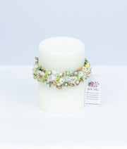 Elegant handcrafted baby baptism candle decorated with premium off-white lace, flowers, and pearl details.