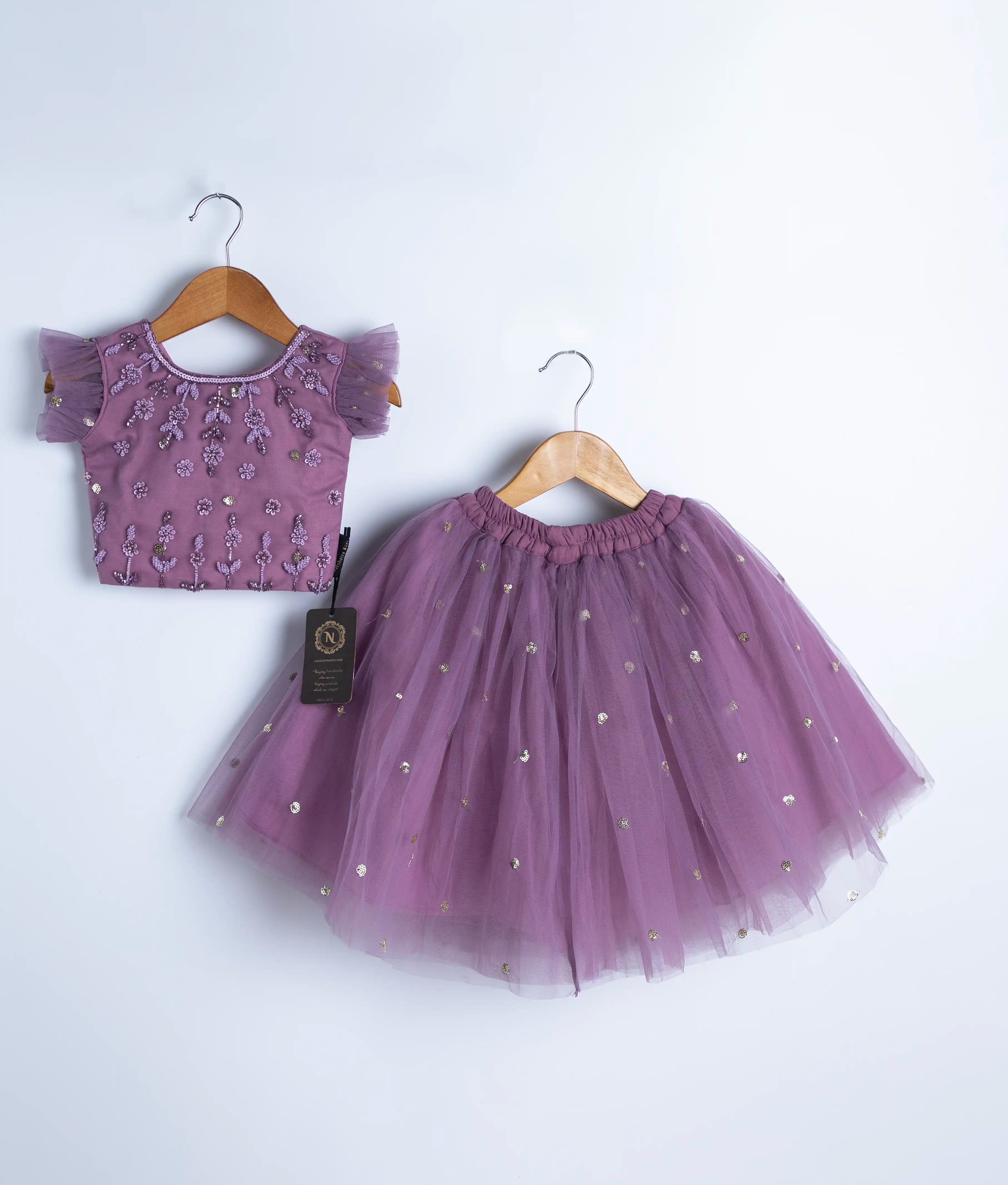 Handmade mauve baby girl outfit with embroidered top and pearl-studded tulle skirt