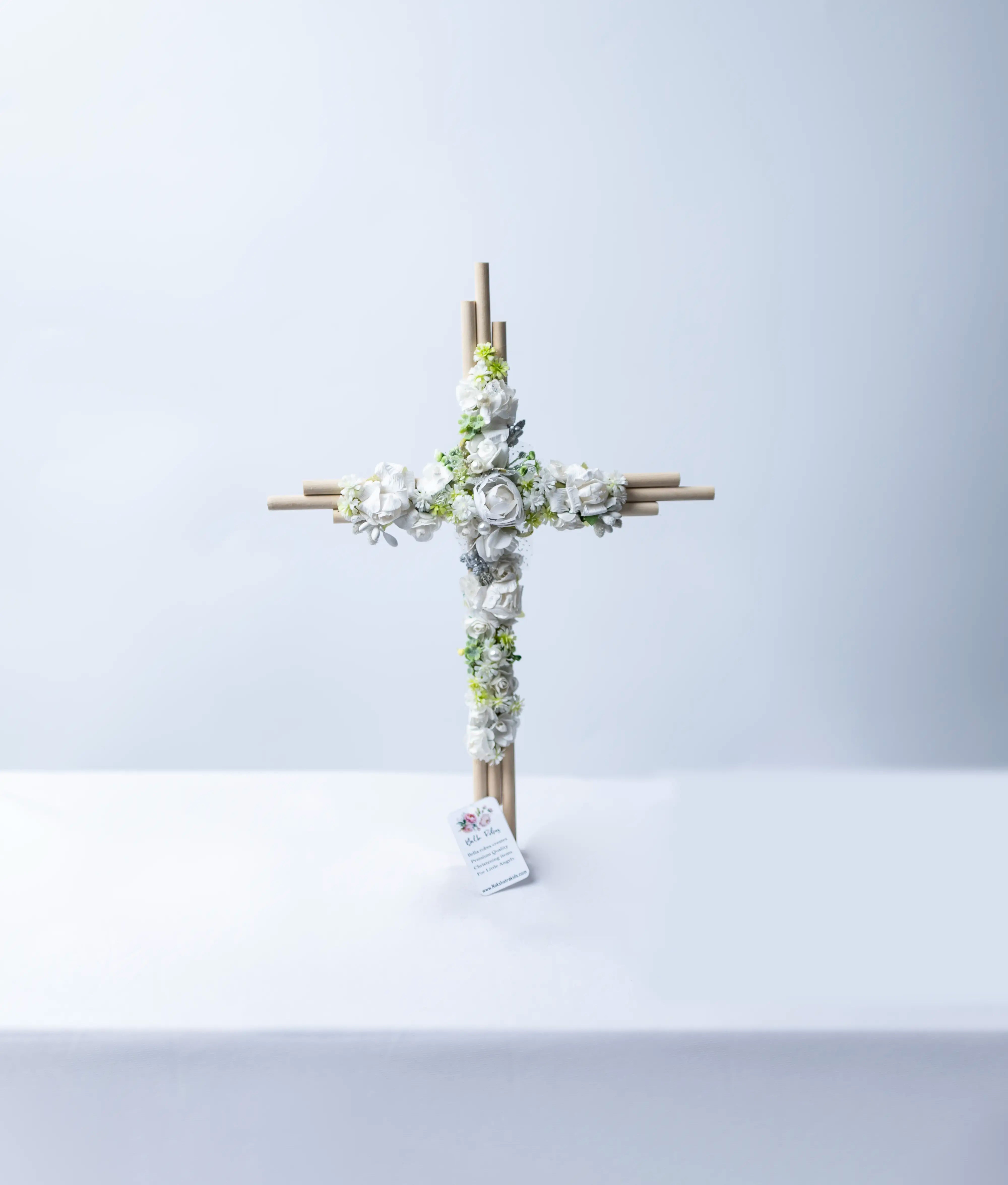Handcrafted baptism cross for babies decorated with premium off-white lace, flowers, and pearl details.