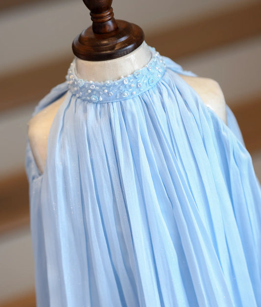 Close-up of the hand-embedded beads and sequins on the high-neck collar and the micro-pleated shimmer georgette fabric.