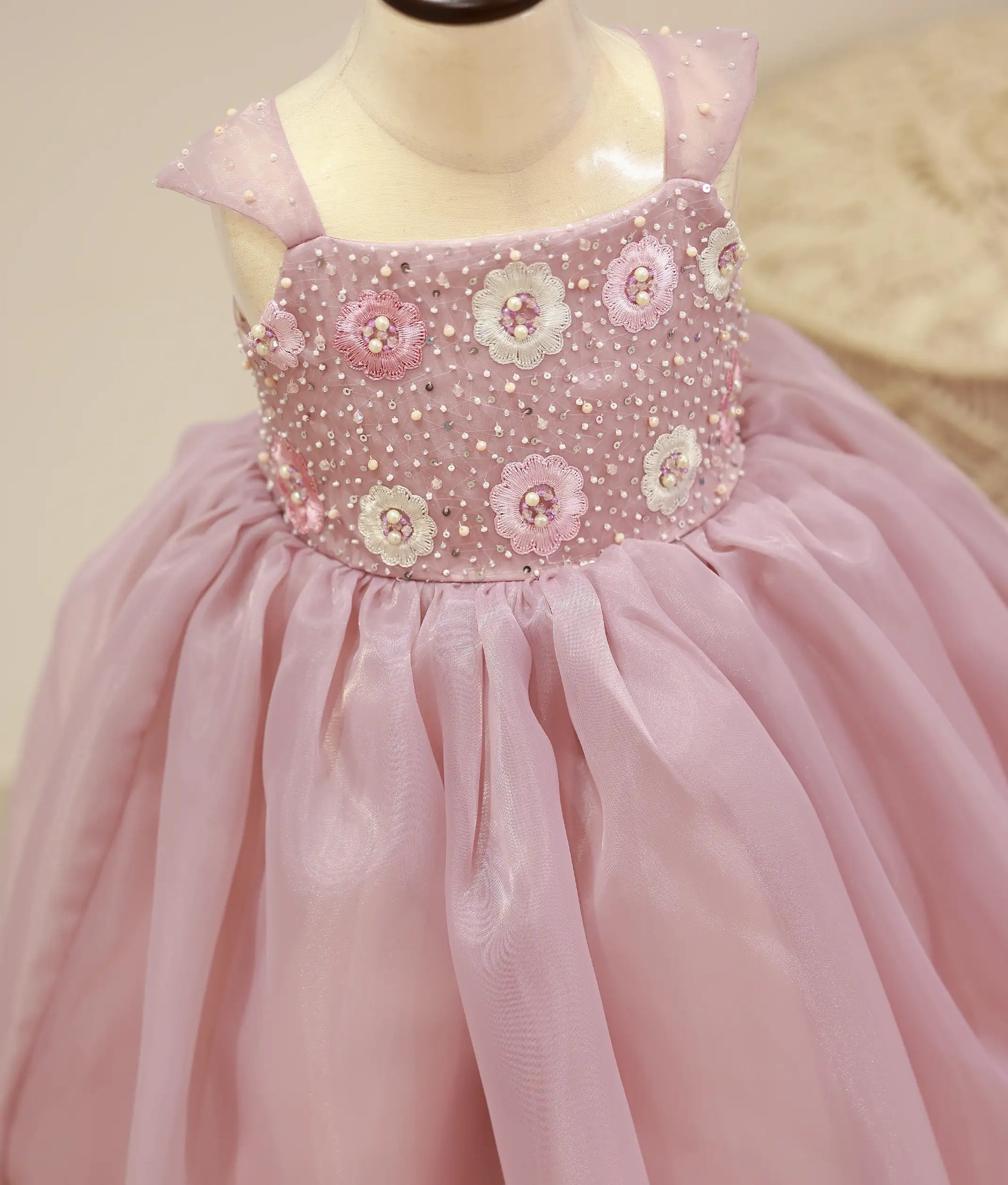 Close-up of the pastel lavender gown yoke showing the intricate handwork with pearls, sugar beads, and crystals