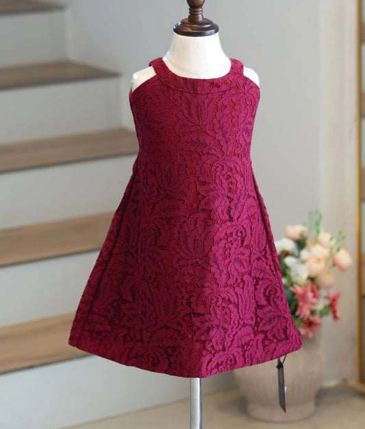 Front view of a baby girl's maroon corded lace frock with floral patterns and a halter neck.