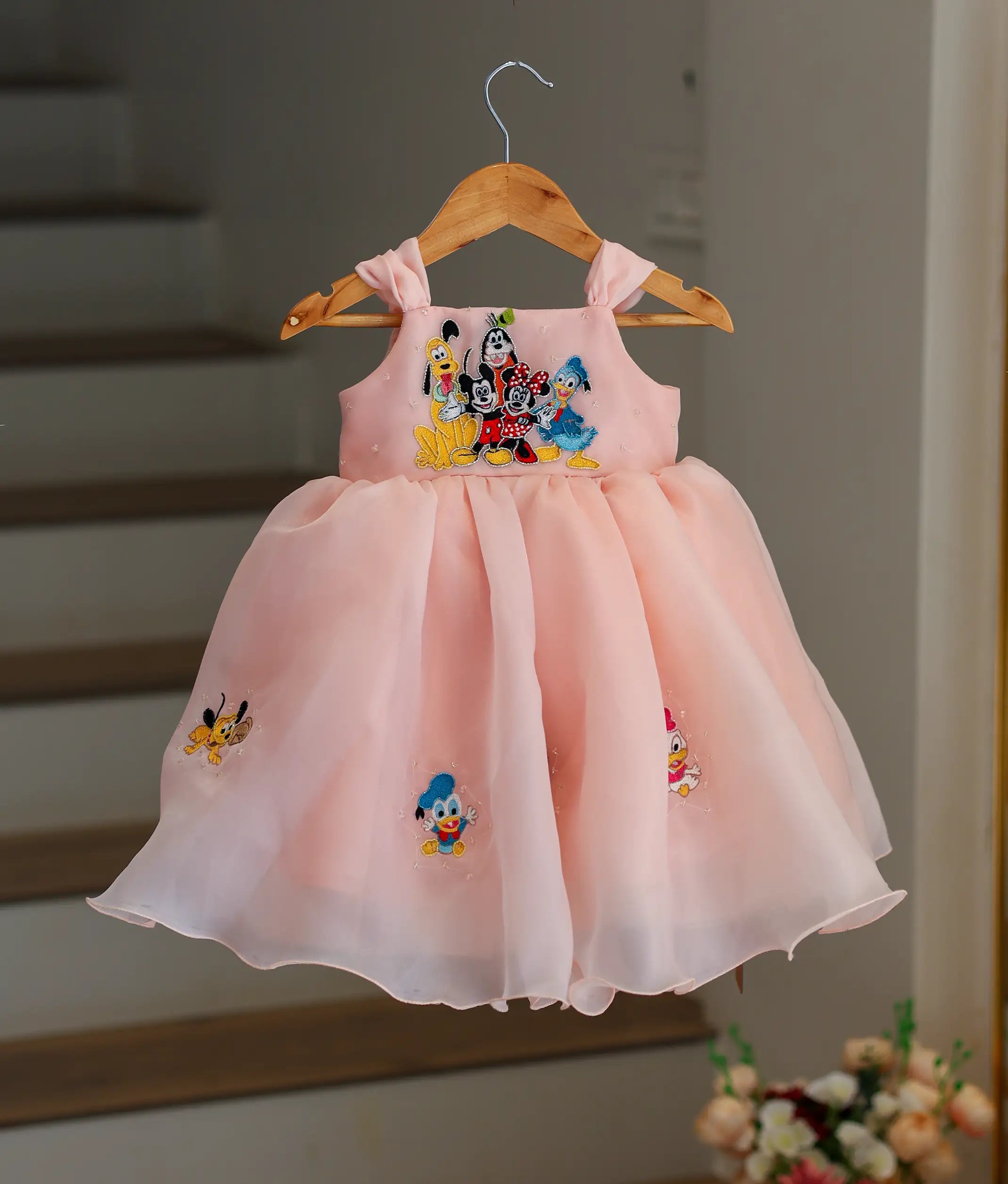 Front view of a Mickey Mouse themed birthday frock for girls with a red and black layered tulle skirt