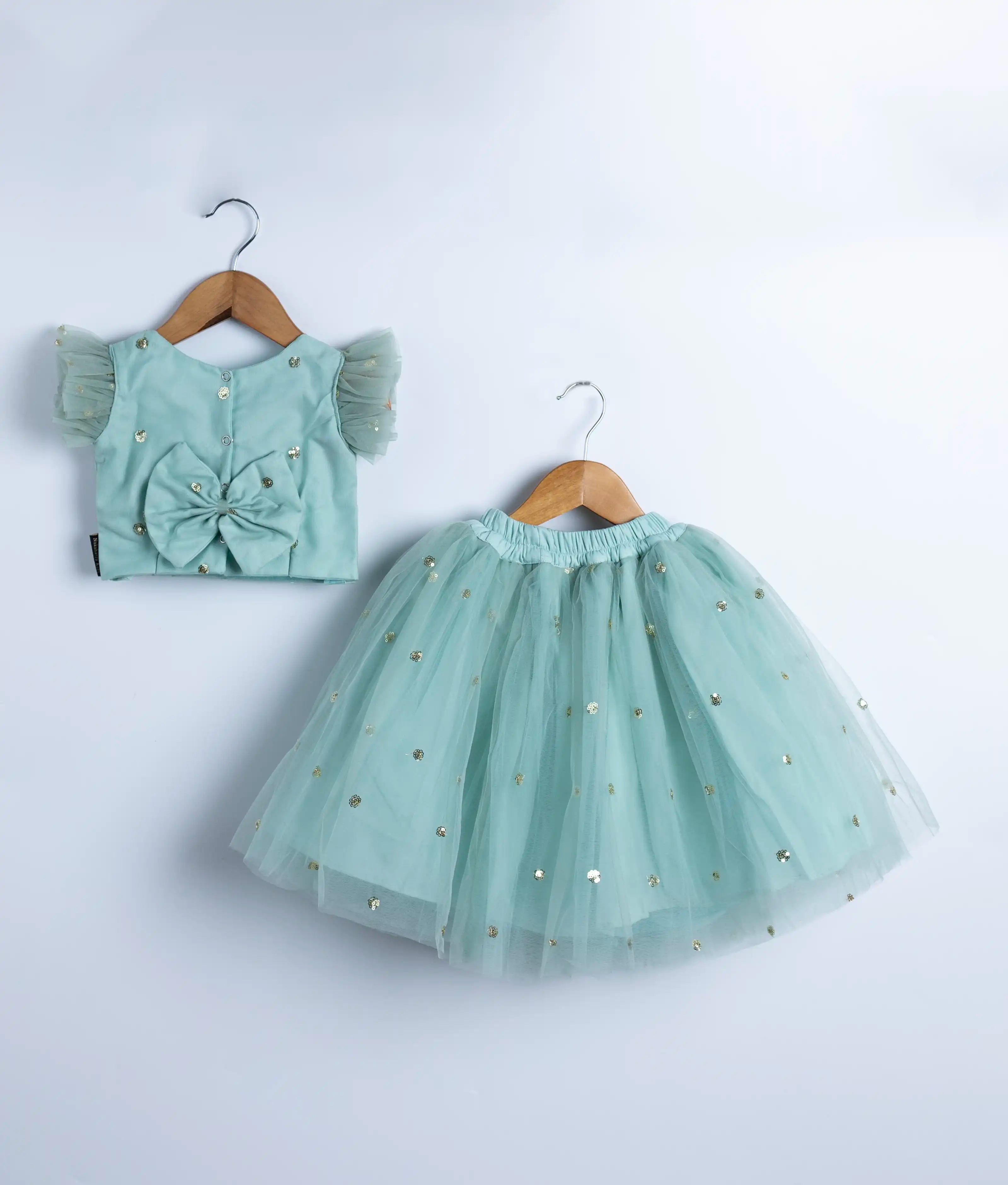 Mint green baby girl skirt and top set with handmade sequin applique and ruffle detailing