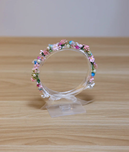multi color handcrafted floral crown for baby girls with a lace-wrapped band and ribbon tie