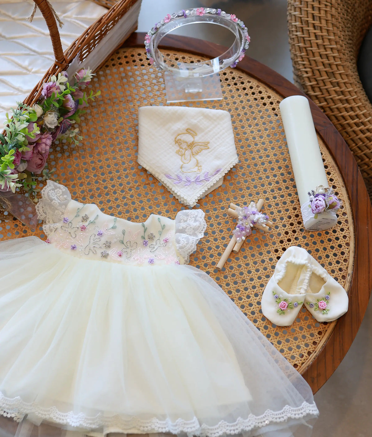 Complete off-white handworked baptism set for baby girl featuring frock, booties, floral headband, decorated candle, cross, and angel embroidered handkerchief.