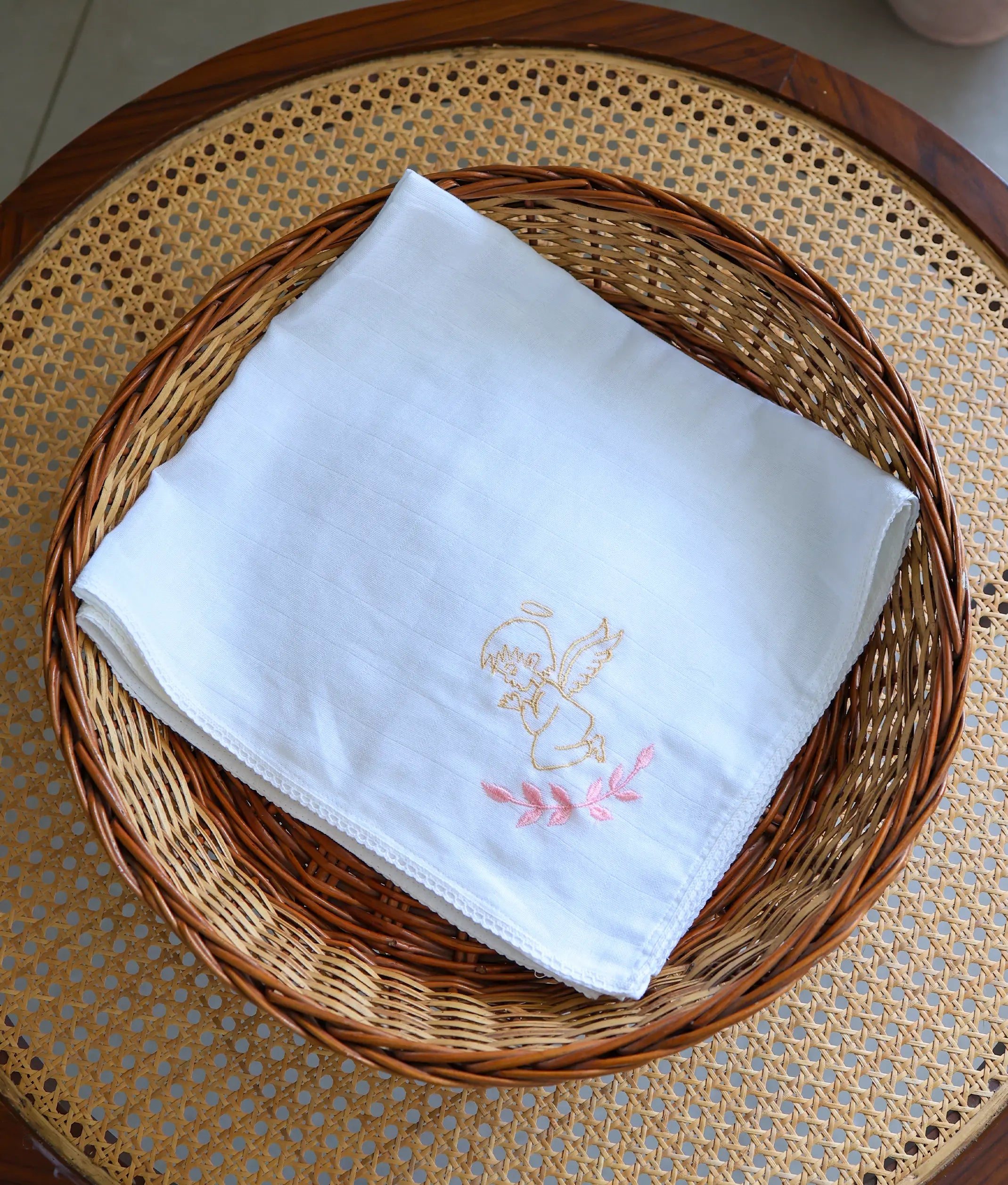 Front view of an off-white angel embroidery cotton baptism towel.