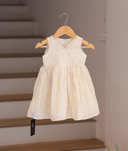 Front view of an off-white cotton frock for baby girls with pastel stripes and lace-trimmed crossover neckline