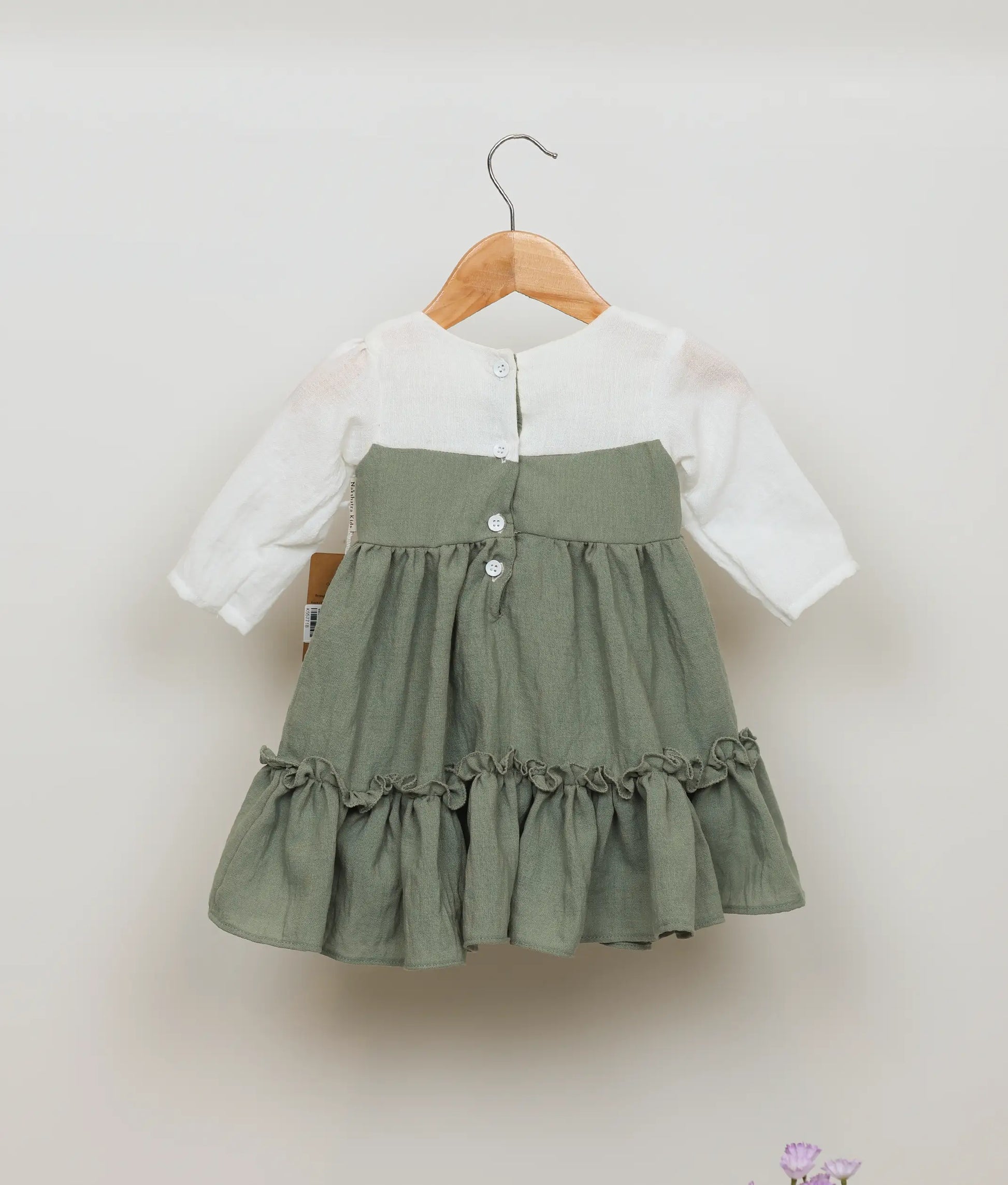 Back view of an green linen floral embroidery christmas frock for bay girls.