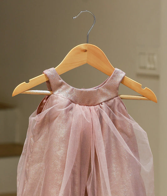 Close-up of the onion-pink frock showing the shimmering Milan foil texture and the halter neck design.