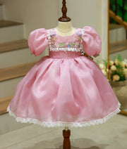 Front view of a pastel lavender floral embroidery birthday frock for baby girls with balloon sleeves and lace trims