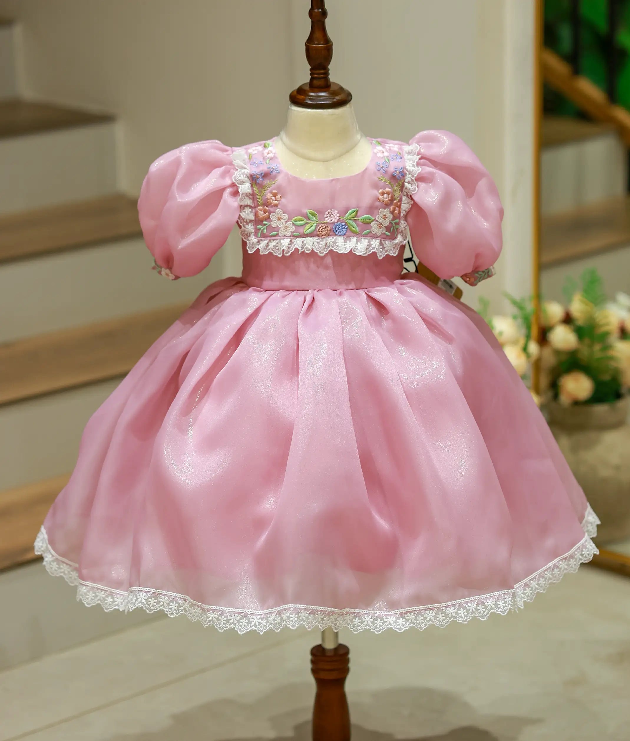 Front view of a pastel lavender floral embroidery birthday frock for baby girls with balloon sleeves and lace trims