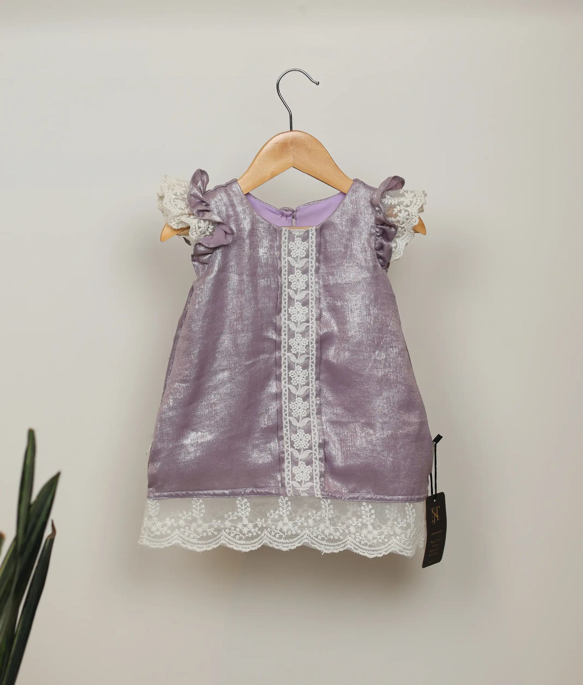 Pastel lavender Milan foil frock with ruffled sleeves and vertical lace trim for baby girls.