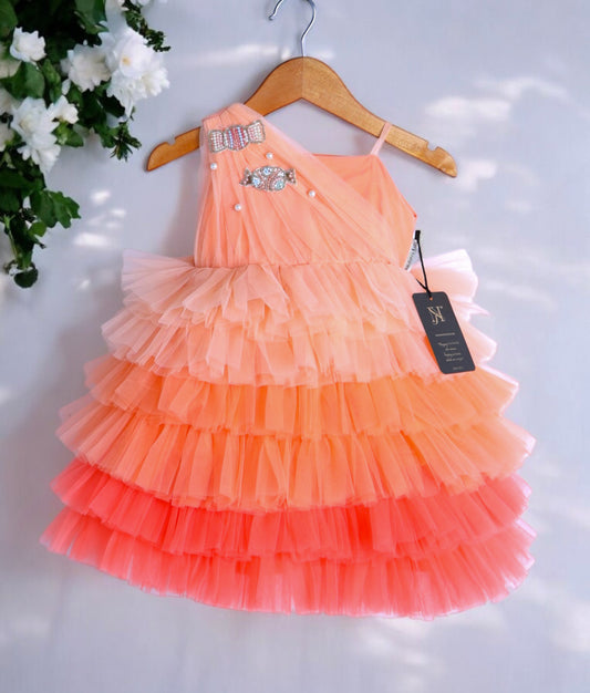 Front view of the peach multi-shade candy-themed birthday frock for girls featuring layered tulle and candy-shaped handwork.