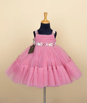 Front view of pink birthday frock for baby girl with floral waist belt – Versatile Fashion