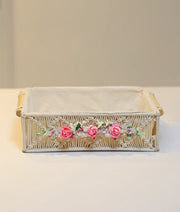 Hand-decorated pink baptism basket for baby girl featuring white lace, silk flowers, and premium fabric lining