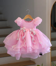 Pink organza high-low birthday frock for baby girl with handworked floral bows