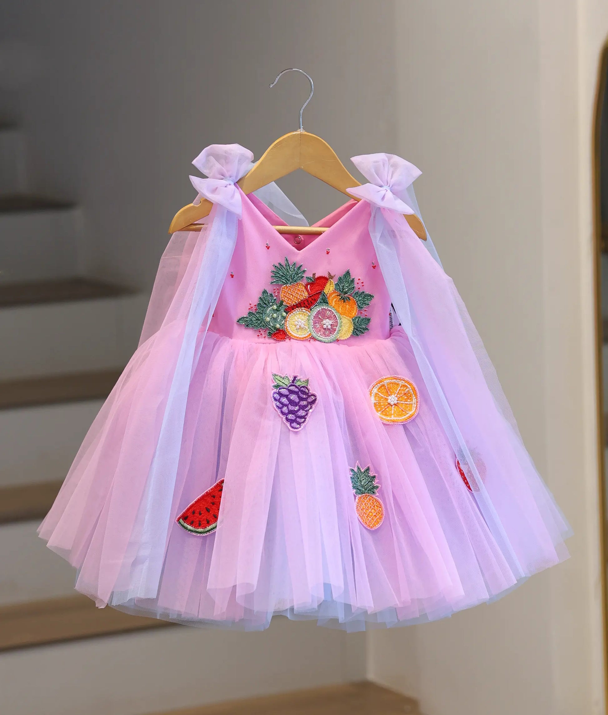 pink and purple girl's party dress with fruit embroidery, layered tulle skirt, shoulder bow drapes and princess design front view