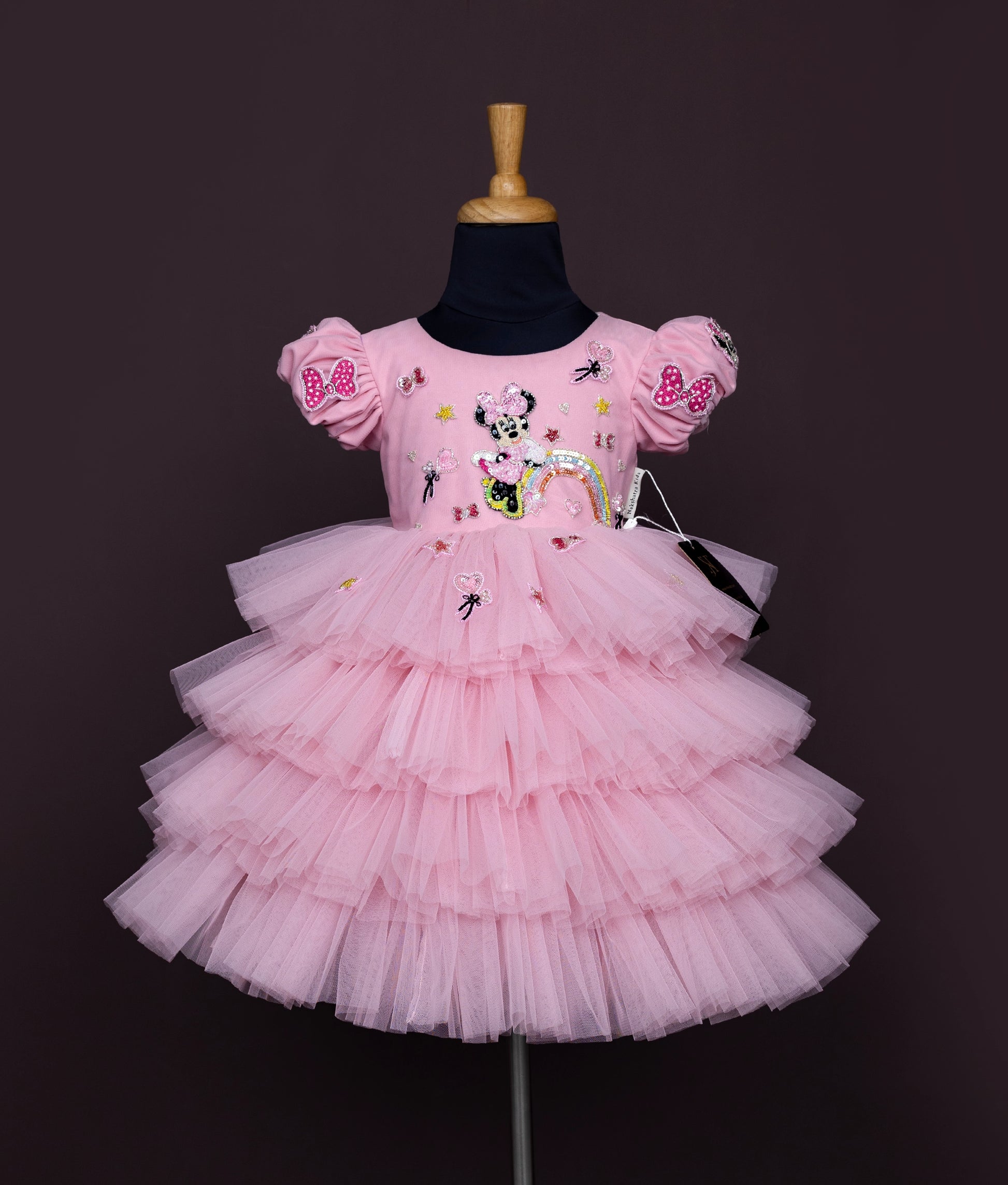 Pink baby girl dress with puff sleeves, Minnie Mouse sequin work, and layered net tulle skirt.