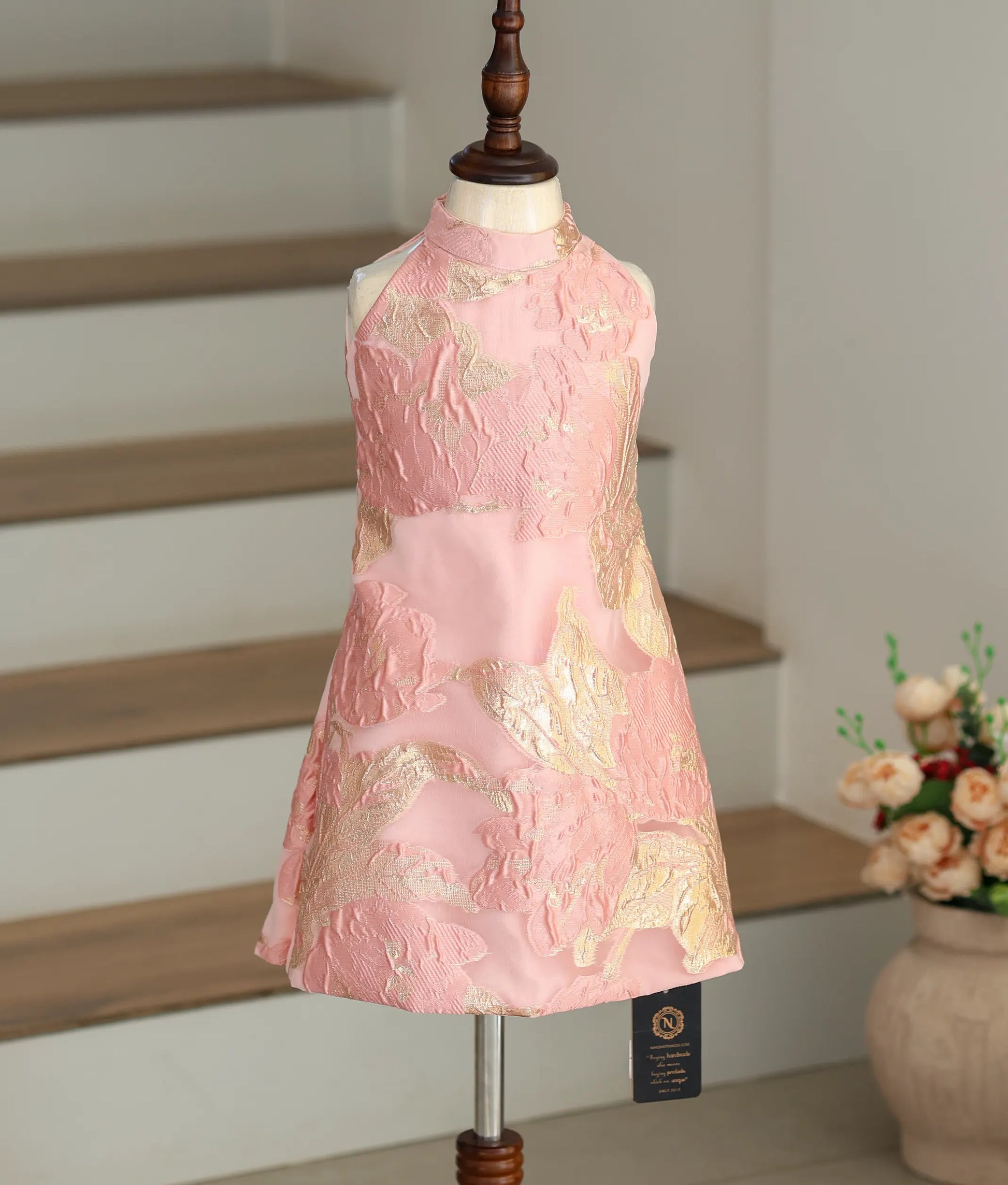 Front view of the pink and gold Turkish organza A-line frock with a high-neck halter design.