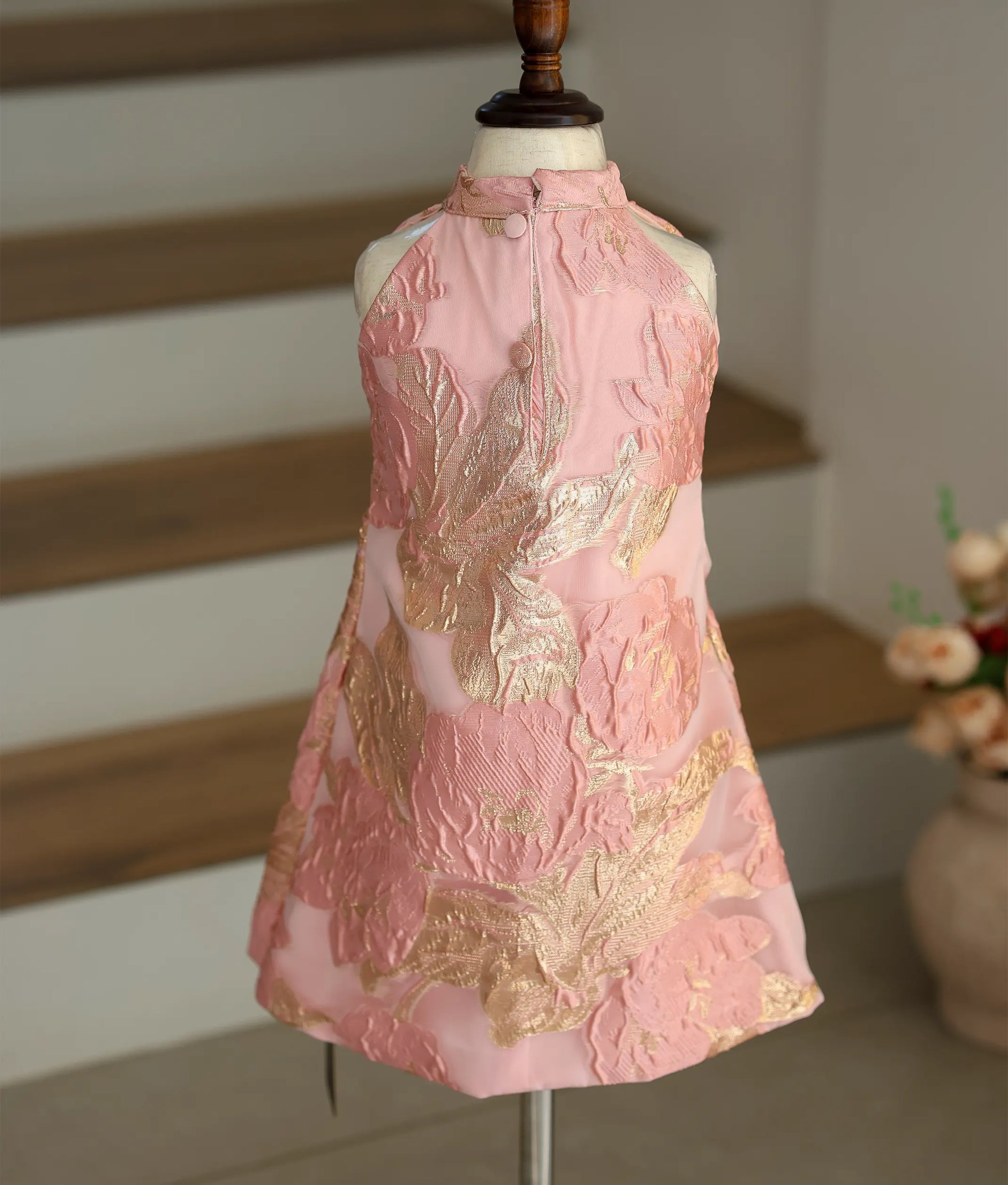 Back view of the pink Turkish organza frock showing the high-neck with button closure and the smooth A-line finish.