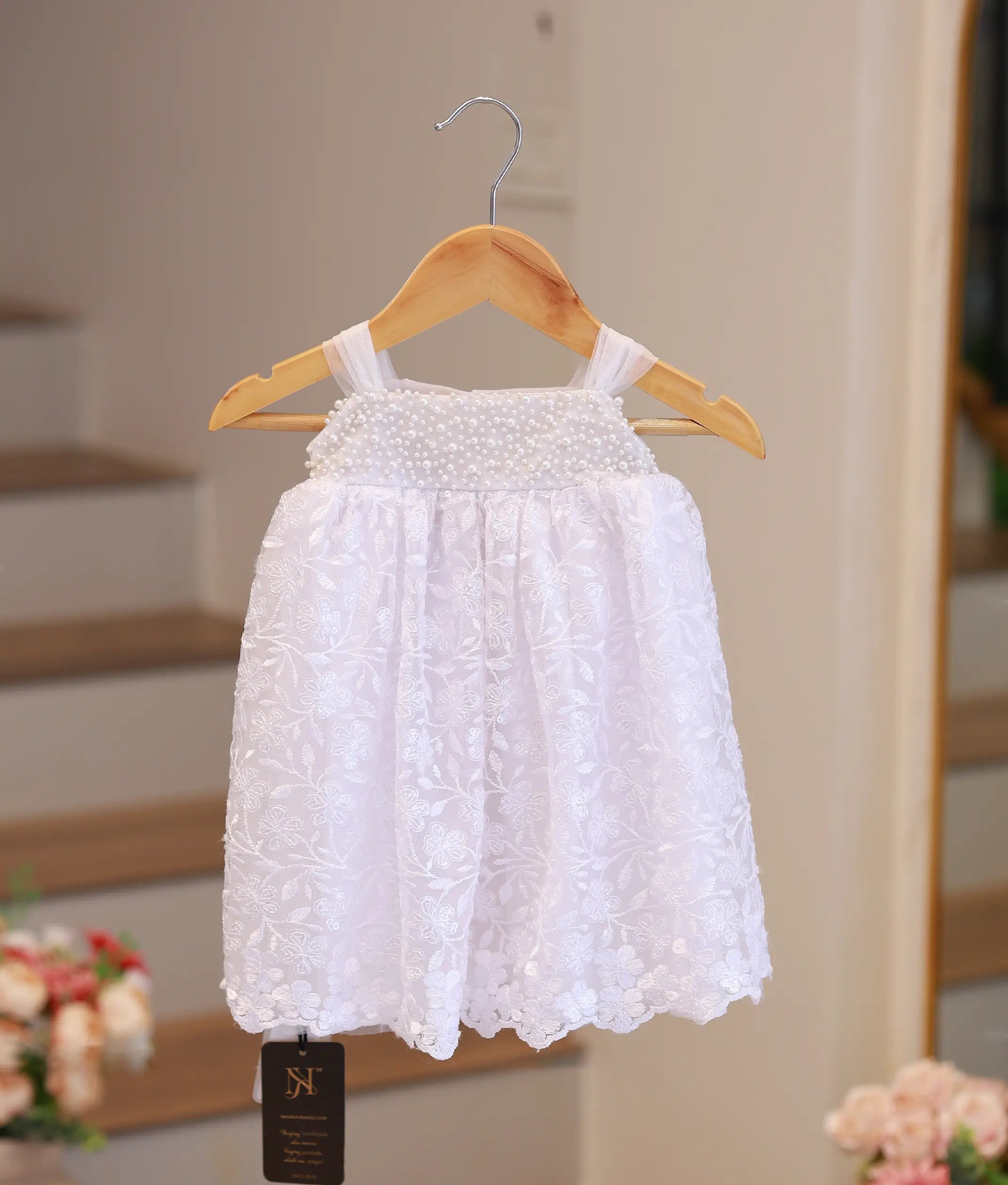 Pure white baby girl baptism frock featuring handcrafted pearl embroidery and delicate lace detailing