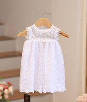 Pure white baptism frock for baby girl with handcrafted embroidery and delicate lace ruffles
