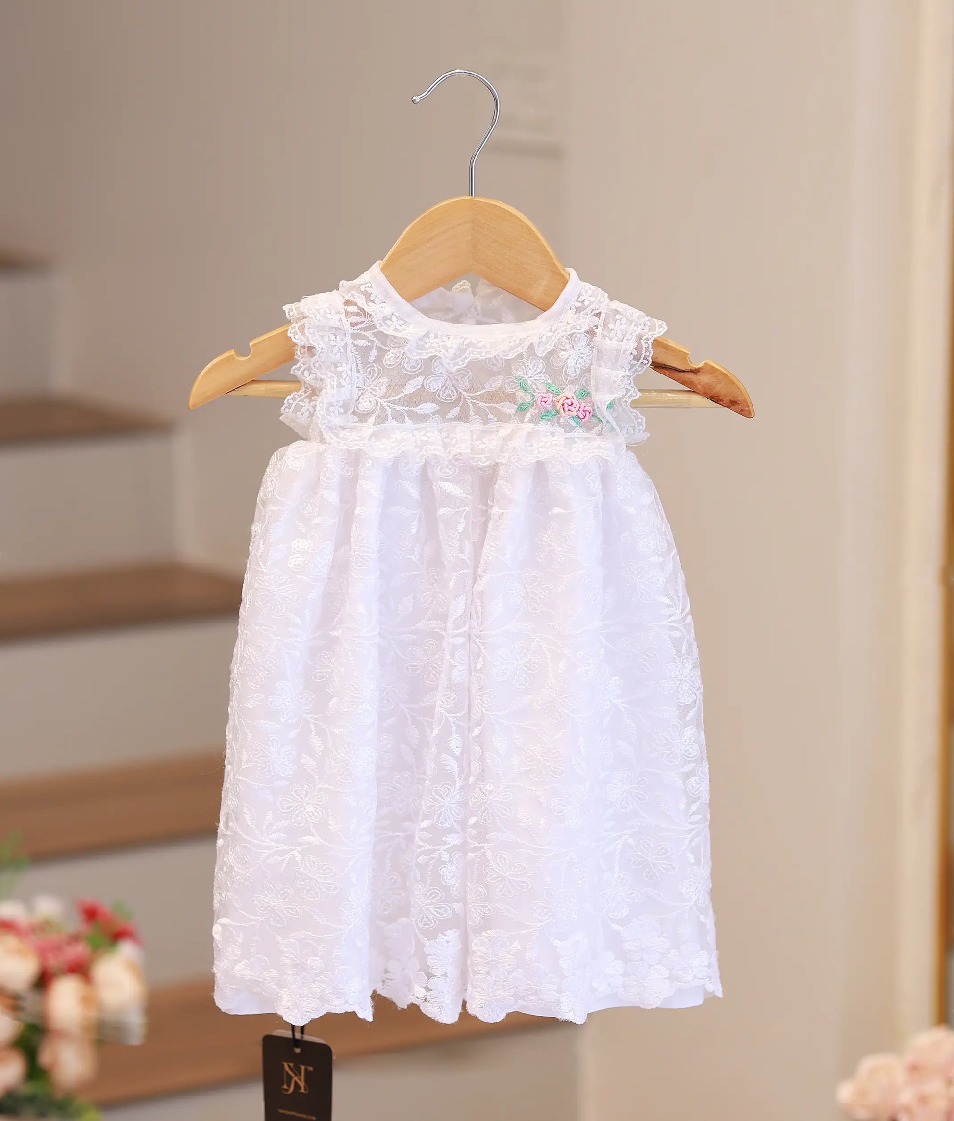 Pure white baptism frock for baby girl with handcrafted embroidery and delicate lace ruffles