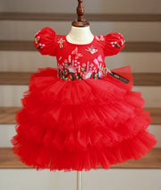 Front view of a red tulle butterfly theme birthday dress for girls with tiered ruffles and handwork
