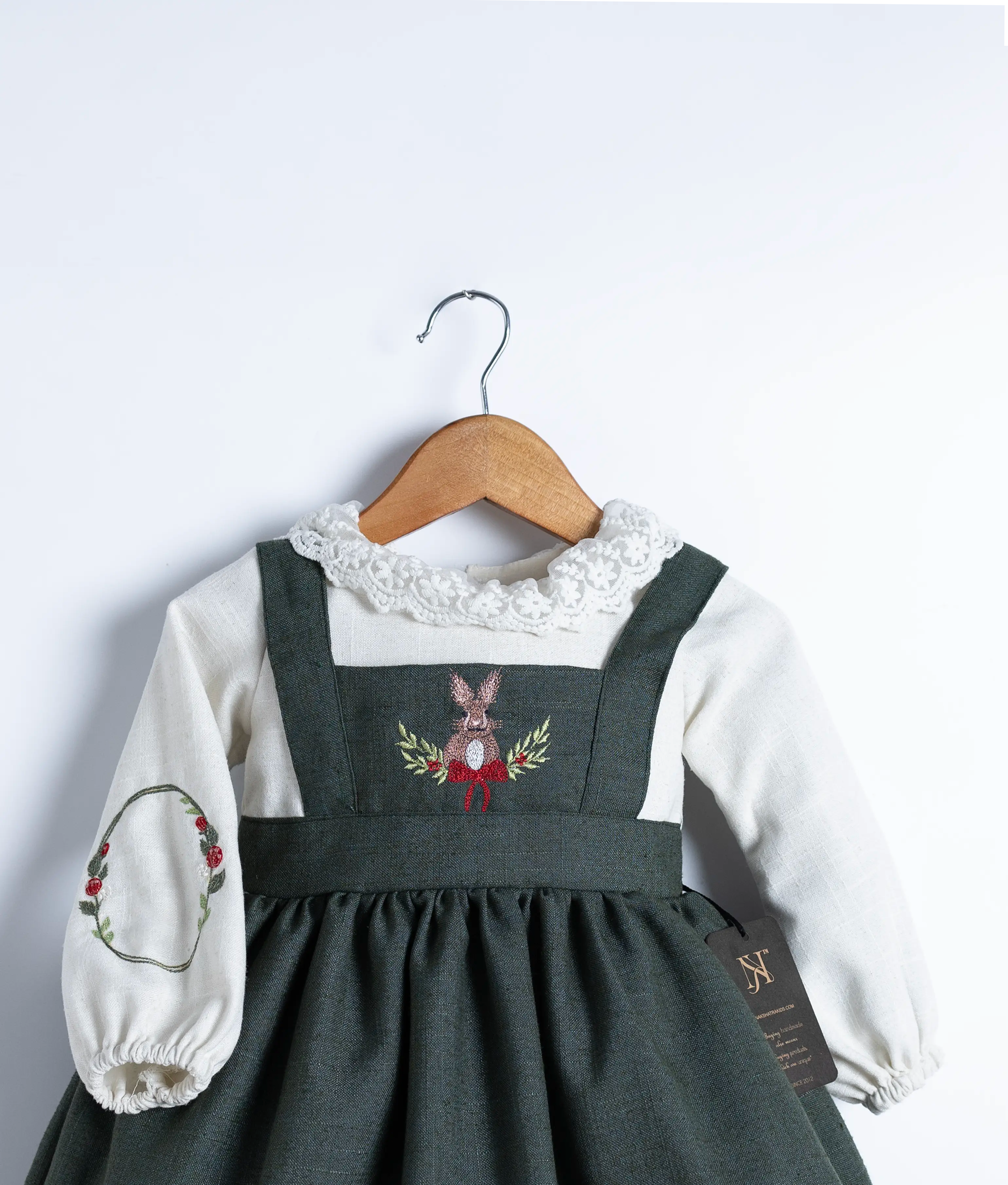 Knee-length, flowing linen skirt dress with long sleeves, perfect for winter occasions