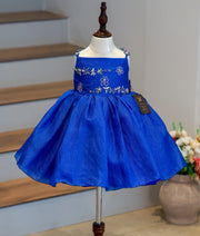 Front view of a royal blue crush organza flower girl theme frock with floral embroidery and a flared skirt