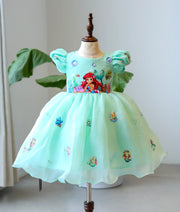 Front view of a sea green mermaid theme birthday dress for girls with hand-painted sea creaturessea-green-mermaid-theme-birthday-dress-front-view