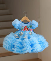 Full front view of sky blue organza and tulle net handworked mermaid-themed frock with ruffled skirt