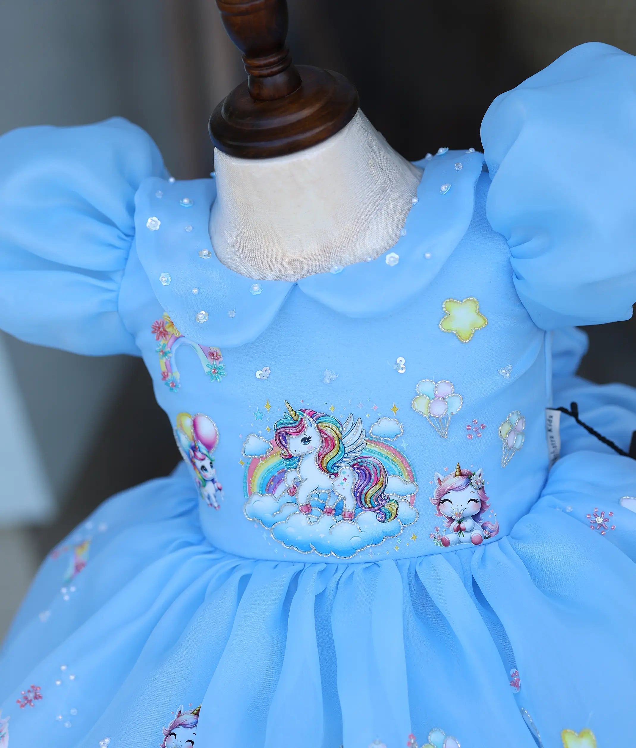 Sky blue baby girl frock bodice with Peter Pan collar and handworked unicorn embroidery